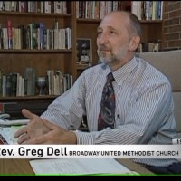 Greg Dell at desk in office at Broadway UMC